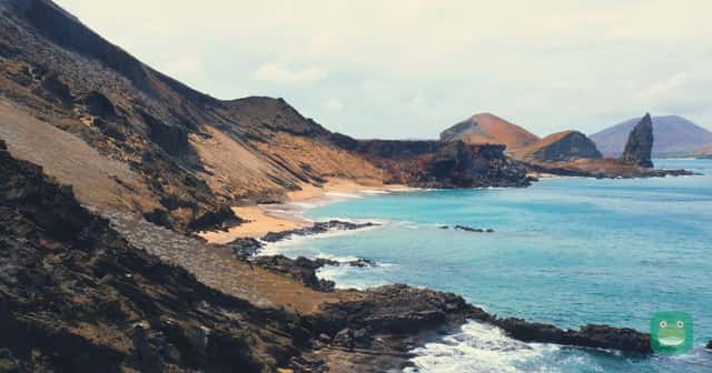 Galápagos — volcanic hills of Bartolomé Island beside the sea
